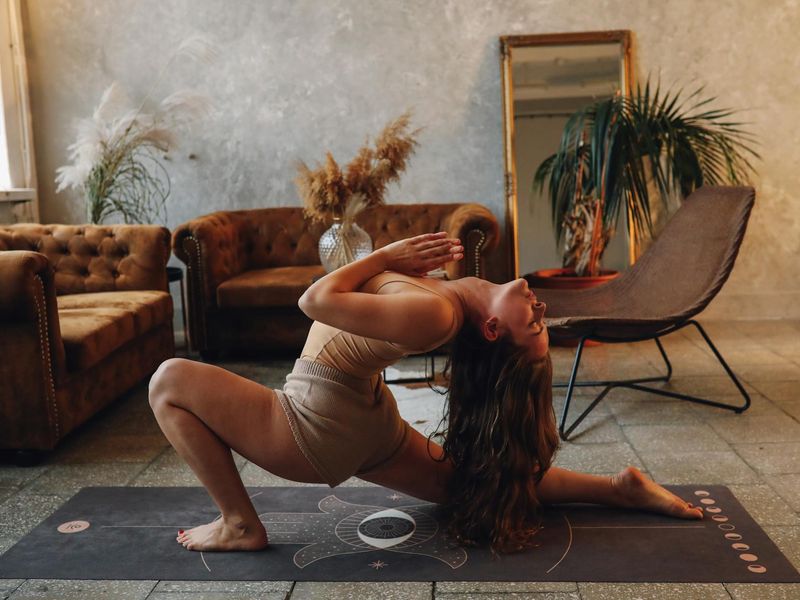 Serene yoga studio atmosphere with soft blue lighting.